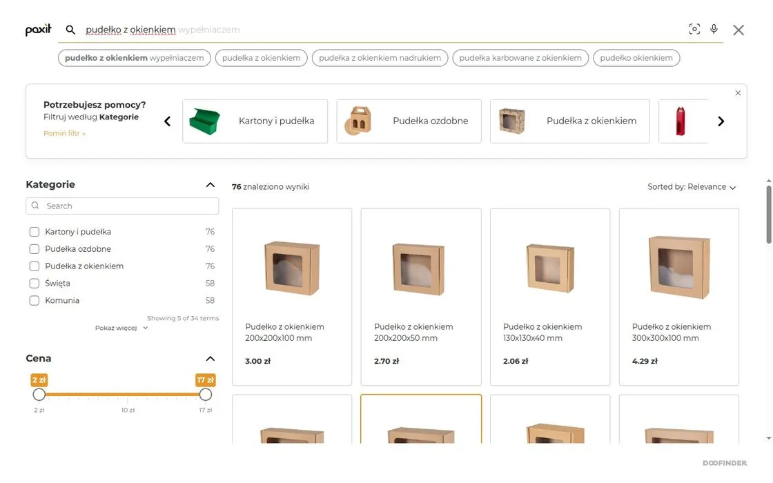 Doofinder search results in the Paxit store for the query “pudełko z okienkiem”: 76 results, related phrase suggestions, category filters and a price slider